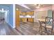 Bright eat-in kitchen features wooden cabinets, stainless steel appliances, and hardwood flooring at 505 Hedge Row Rd, Brandon, FL 33510