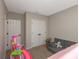Bedroom featuring carpet floors, a double door closet and neutral paint at 34327 Verbena St, Wesley Chapel, FL 33545
