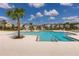 Community pool area with lounge chairs and a clear view of the surrounding neighborhood homes at 34327 Verbena St, Wesley Chapel, FL 33545