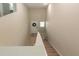 High ceiling foyer with stairs, a bright white front door with a glass window at 34327 Verbena St, Wesley Chapel, FL 33545