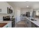 Bright kitchen featuring stainless steel appliances, ample counter space, and an island at 34327 Verbena St, Wesley Chapel, FL 33545