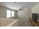Cozy loft with ample natural light, neutral walls, plush carpet, and built-in entertainment center at 34327 Verbena St, Wesley Chapel, FL 33545