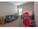 Cozy playroom furnished with a gray sofa and adorned with vibrant toys, perfect for children at 34327 Verbena St, Wesley Chapel, FL 33545