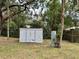 Backyard shed featuring a metal container, providing ample outdoor storage space and convenience at 4213 Temple Heights Rd, Tampa, FL 33617