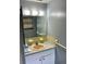 Bathroom featuring vanity with peach colored sink and a large mirror at 4213 Temple Heights Rd, Tampa, FL 33617