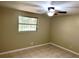 Cozy bedroom with tiled flooring, a ceiling fan, and natural light at 4213 Temple Heights Rd, Tampa, FL 33617