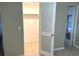 Bedroom closet with a louvered door and a view into the bathroom at 4213 Temple Heights Rd, Tampa, FL 33617