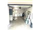 Garage space featuring laundry hookups, storage shelving, and an open layout offering flexible usage at 4213 Temple Heights Rd, Tampa, FL 33617