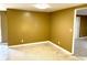 This is an empty living room featuring a neutral paint color and tile flooring throughout at 4213 Temple Heights Rd, Tampa, FL 33617