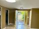The living room features a decorative glass front door and recessed ceiling lighting at 4213 Temple Heights Rd, Tampa, FL 33617