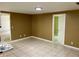 A bright living room with tile floors, neutral walls, and a view into another room at 4213 Temple Heights Rd, Tampa, FL 33617