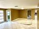 Spacious living room featuring tile flooring and neutral wall colors for easy customization at 4213 Temple Heights Rd, Tampa, FL 33617