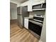 Kitchen view featuring stainless steel appliances, a countertop and cabinets at 4617 John Bell Jr Dr, Tampa, FL 33610