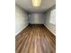 An empty room that features modern flooring and an exit door at 4617 John Bell Jr Dr, Tampa, FL 33610
