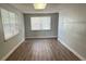 Spacious room with modern flooring and bright natural light at 4617 John Bell Jr Dr, Tampa, FL 33610