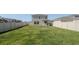 Expansive backyard featuring well-maintained lawn and privacy fence at 6438 Milestone Loop, Palmetto, FL 34221