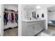 This full bathroom includes a closet, shower and double sinks at 6438 Milestone Loop, Palmetto, FL 34221