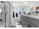This is a large bathroom with double sinks and a walk-in shower at 6438 Milestone Loop, Palmetto, FL 34221