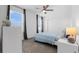 Bedroom featuring plush carpeting, a ceiling fan, and curtains for blocking sunlight at 6438 Milestone Loop, Palmetto, FL 34221