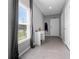 Bright entryway featuring a window, a small desk area, and neutral paint, creating a welcoming entrance at 6438 Milestone Loop, Palmetto, FL 34221