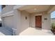 This home features a front porch and a storm door at 6438 Milestone Loop, Palmetto, FL 34221