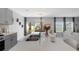 Modern kitchen with stainless steel sink, quartz countertops, and stylish lighting fixtures at 6438 Milestone Loop, Palmetto, FL 34221