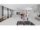Bright, open-concept kitchen featuring stainless steel appliances and a spacious island with quartz countertops at 6438 Milestone Loop, Palmetto, FL 34221