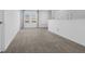 Bright loft with neutral carpeting, large window, and soft, natural light at 6438 Milestone Loop, Palmetto, FL 34221