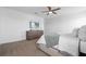 This main bedroom features a dresser and television at 6438 Milestone Loop, Palmetto, FL 34221
