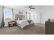 This main bedroom features a ceiling fan, and ensuite bathroom at 6438 Milestone Loop, Palmetto, FL 34221