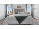 This main bedroom features natural light and modern interior at 6438 Milestone Loop, Palmetto, FL 34221