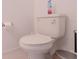 Close-up shot of a standard white toilet with a closed lid, complete with a toilet paper holder at 6438 Milestone Loop, Palmetto, FL 34221