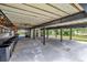 Basement with structural beams, concrete floors, view of the outdoor space, and natural lighting at 9503 Alice Ln, Riverview, FL 33578