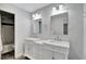 Bright bathroom features double vanity with marble countertops and modern fixtures at 9503 Alice Ln, Riverview, FL 33578