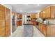 Spacious kitchen with granite countertops, stainless steel appliances, and light wood cabinetry at 9503 Alice Ln, Riverview, FL 33578