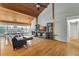 Spacious living room boasts a vaulted wood ceiling, fireplace, and abundant natural light at 9503 Alice Ln, Riverview, FL 33578