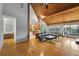 Bright and airy living room with hardwood floors, vaulted ceilings, and an open floor plan at 9503 Alice Ln, Riverview, FL 33578