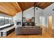 Comfortable living room featuring vaulted ceilings, hardwood floors, and a cozy fireplace at 9503 Alice Ln, Riverview, FL 33578