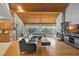 Open-concept living space with a cozy fireplace and seamless flow to the dining area and kitchen at 9503 Alice Ln, Riverview, FL 33578
