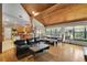 Comfortable living room and dining area featuring a vaulted wood ceiling and natural light at 9503 Alice Ln, Riverview, FL 33578