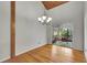 Living room with chandelier and screened patio at 9503 Alice Ln, Riverview, FL 33578