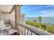 Outdoor balcony providing seating and scenic waterfront views of the harbor at 112 Osprey Point Dr, Osprey, FL 34229