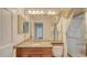 Cozy bathroom features granite countertop, shower, mirror with lighting, and classic design at 112 Osprey Point Dr, Osprey, FL 34229