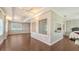 Light-filled bedroom boasts hardwood floors, ceiling fans, and decorative glass block accents at 112 Osprey Point Dr, Osprey, FL 34229