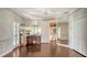 Spacious bedroom with vanity area, hardwood floors, decorative wallpaper, and large closet at 112 Osprey Point Dr, Osprey, FL 34229