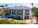 Beautiful three-story home with a tile roof, balconies, and a private pool in the backyard at 112 Osprey Point Dr, Osprey, FL 34229