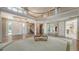 Grand foyer with a large staircase, mirrored walls, and double doors that open to the living space at 112 Osprey Point Dr, Osprey, FL 34229