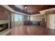 Cozy living room with fireplace, water views, and a decorative ceiling at 112 Osprey Point Dr, Osprey, FL 34229