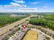Overhead shot of residential complex near shops and hospital, with convenient proximity and a marker pin at 2943 Willowleaf Ln, Wesley Chapel, FL 33544