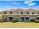 A spacious backyard features well-maintained lawn and a screened lanai at 2943 Willowleaf Ln, Wesley Chapel, FL 33544